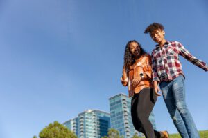 Big Sister Angie and Little Sister Alexa, walking in a park